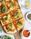 Pizza with tomatoes, cheese and arugula — Stock Photo