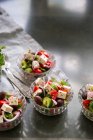 Traditional Greek salad in small glass bowls — Stock Photo