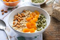 Muesli with fried apricots, almonds and pistachios — Stock Photo