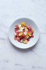 Fresh dates salade with parma ham and goat cheese — Stock Photo