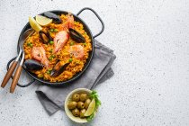 Seafood paella with shrimps and mussels. top view. — Stock Photo