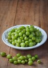 A bowl of fresh gooseberries — Stock Photo
