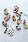Oysters with tabasco and lime — Stock Photo