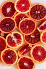 Slices of blood oranges on a white background — Foto stock
