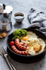 Fried eggs with sausages — Stock Photo