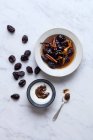 Poached prunes and prune cream — Stock Photo