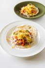 Fish tacos with grilled sea bass, avocado, tomatoes, red onion and cheese — Stock Photo