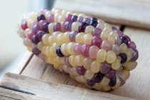 Corn on the cob with colorful grains (close-up) — Photo de stock