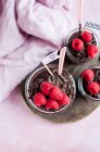 Buckwheat chocolate pudding with raspberries glass jars — Stock Photo