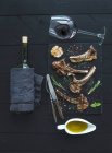 Grilled lamb chops. Rack of Lamb with garlic, rosemary and spices on slate tray — Stock Photo