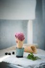 Vegan blackberry ice cream in waffle cone, cone and berries on background — Stock Photo