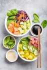 Two assorted poke bowls, raw tuna, salmon, vegetables, fruit — Stock Photo