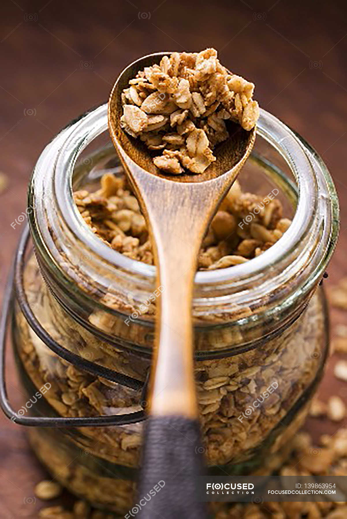 Muesli in glass jar — background, clusters Stock Photo 139863954