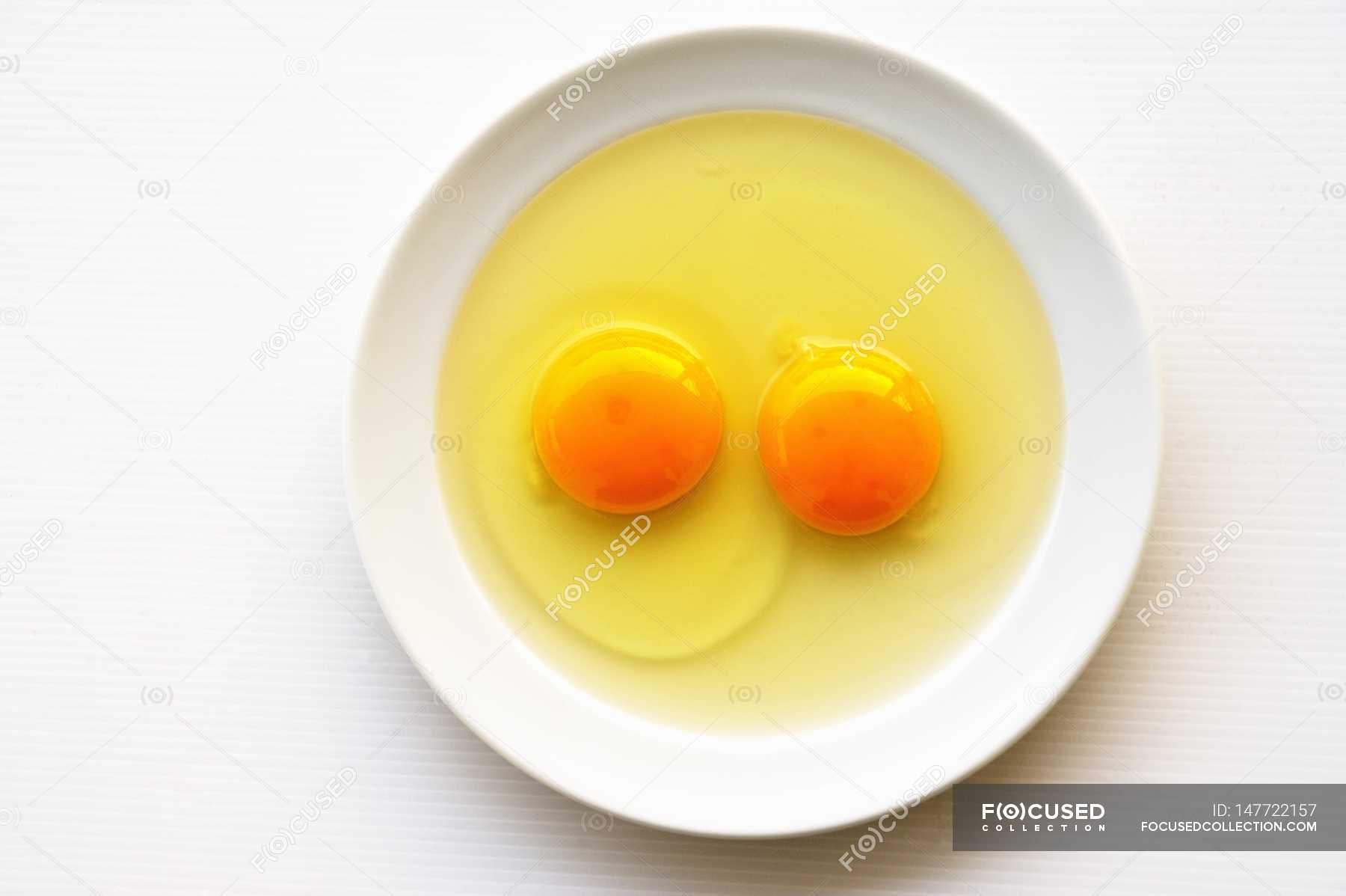 Two cracked eggs — eco, food - Stock Photo | #147722157