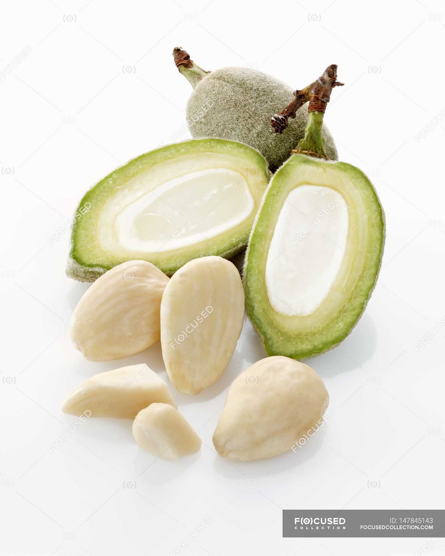 Raw almonds and almond hulls — yummy, healthy Stock Photo 147845143