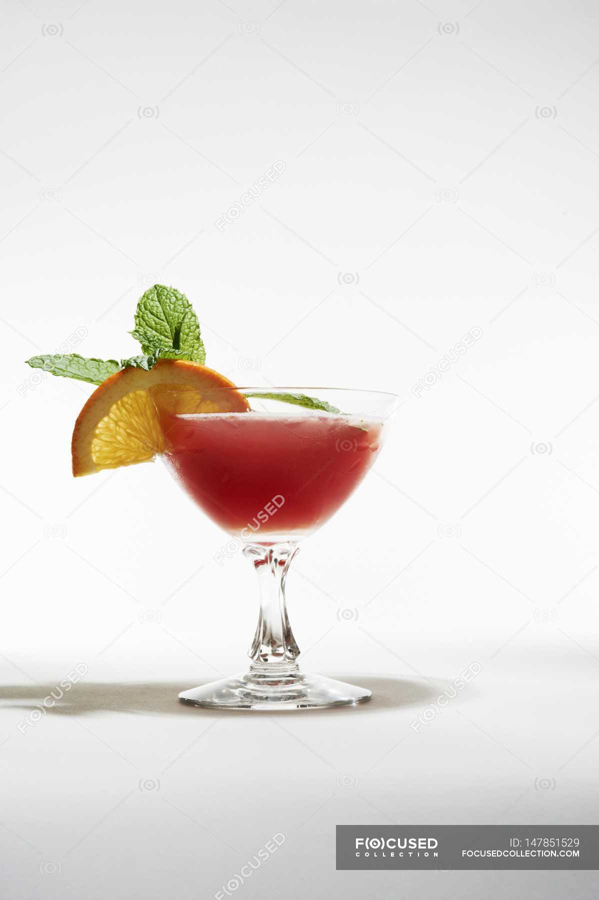 Closeup View Of Frozen Strawberry Daiquiri With Orange And Mint Garnish ...