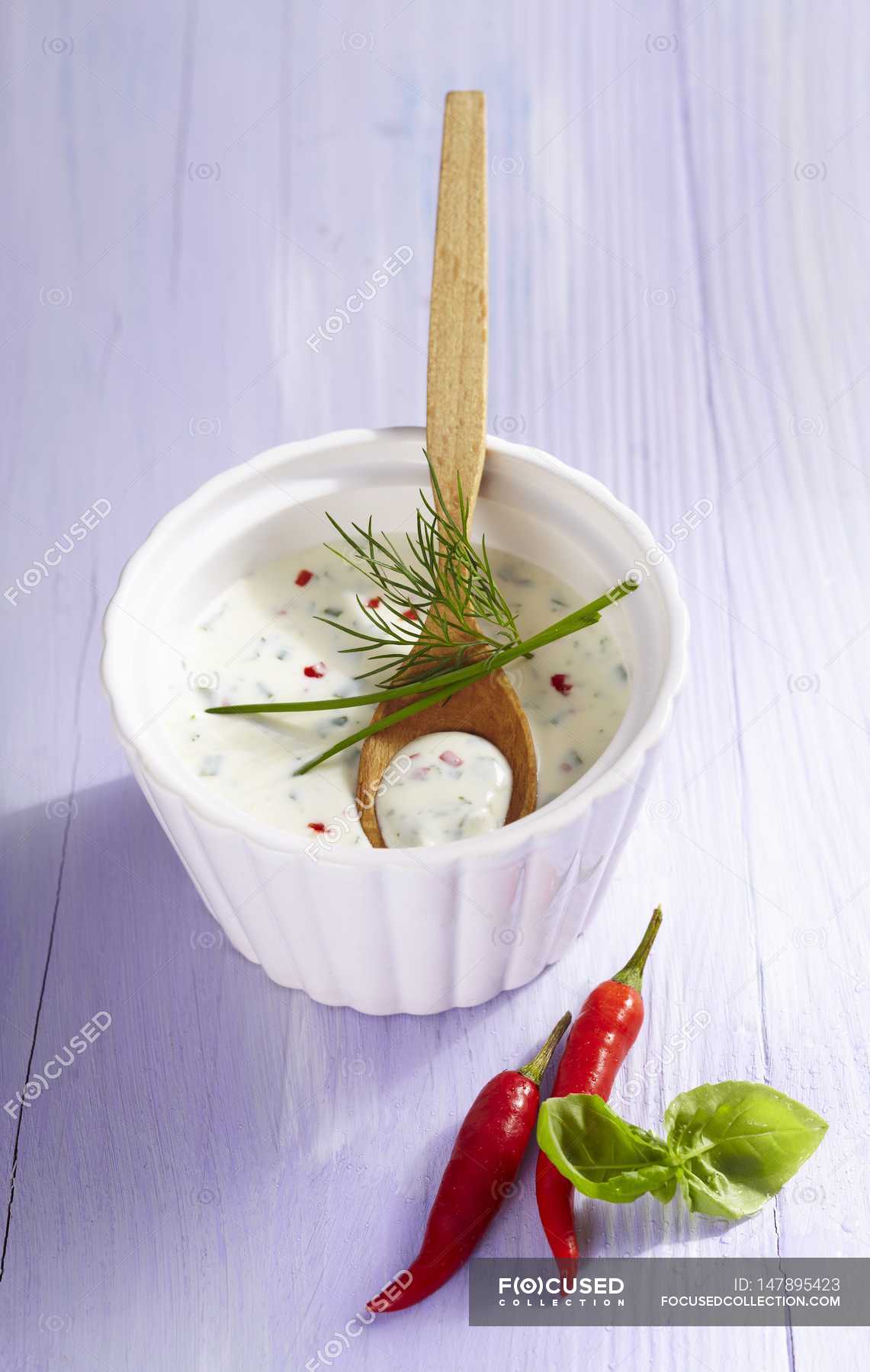 Elevated view of herb and quark dressing with chilli — appetizing