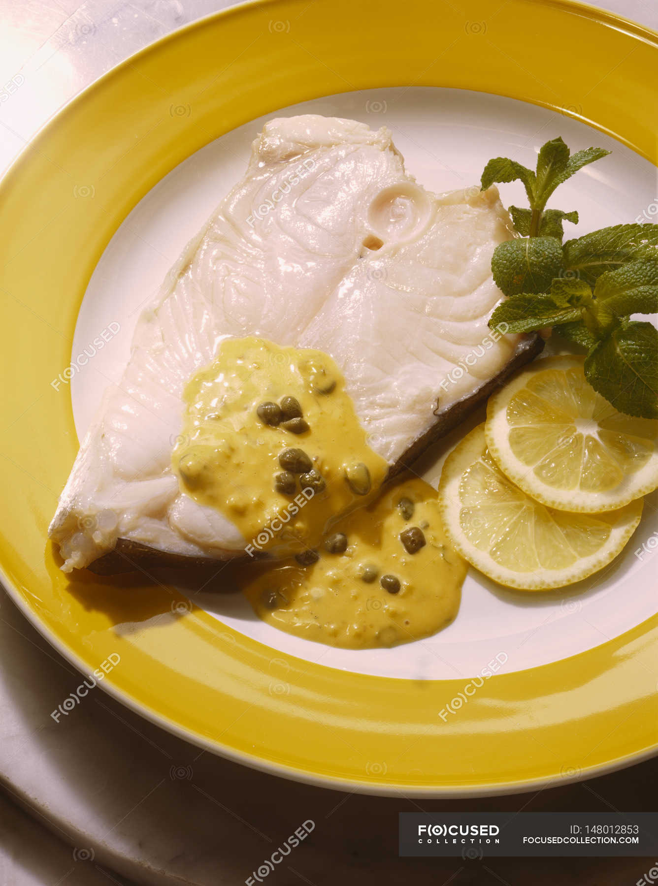 Stewed Halibut with Caper Sauce — appetizing, eating Stock Photo 148012853