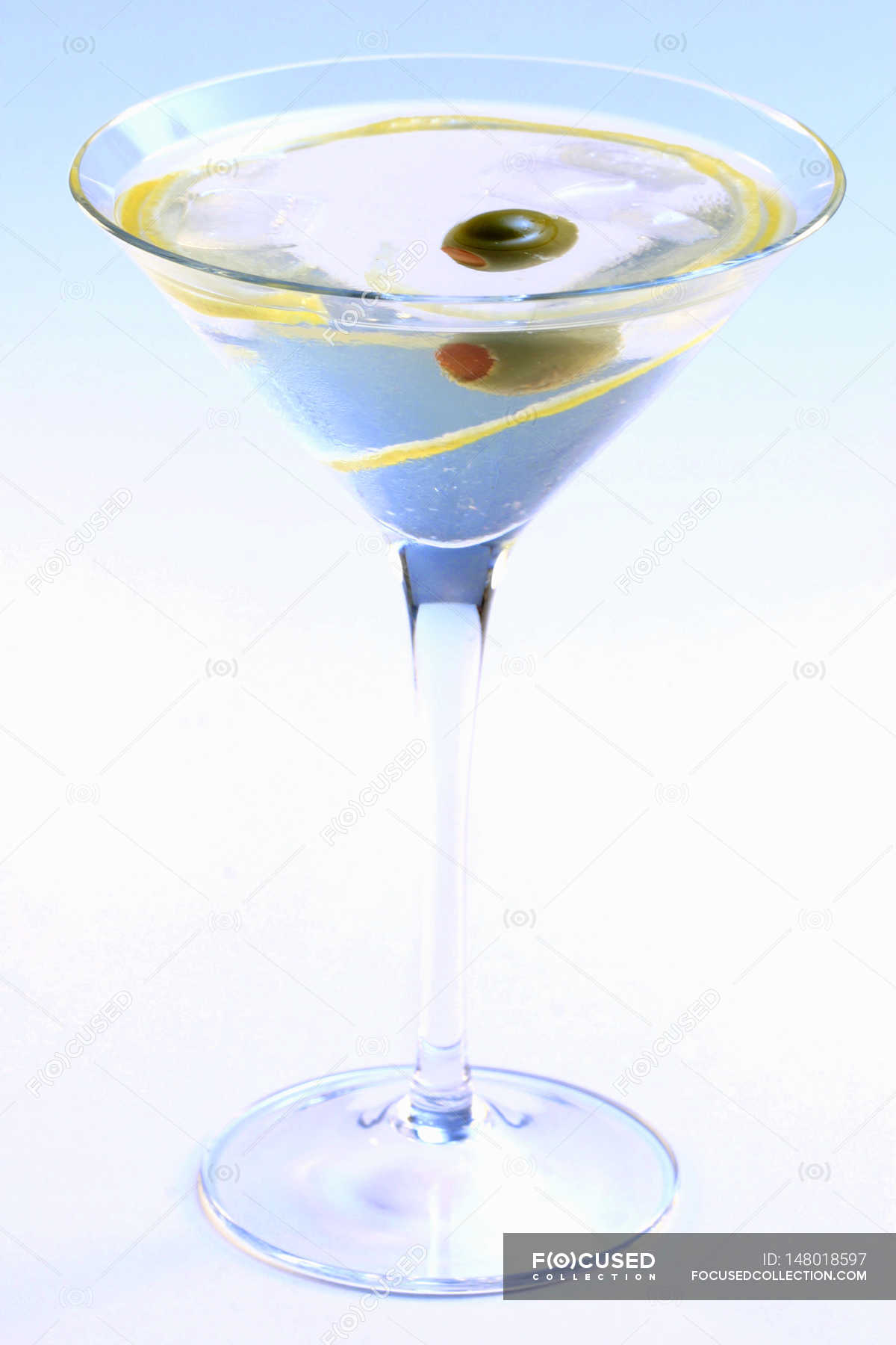 Martini with olive in elegant glass — background, choice - Stock Photo