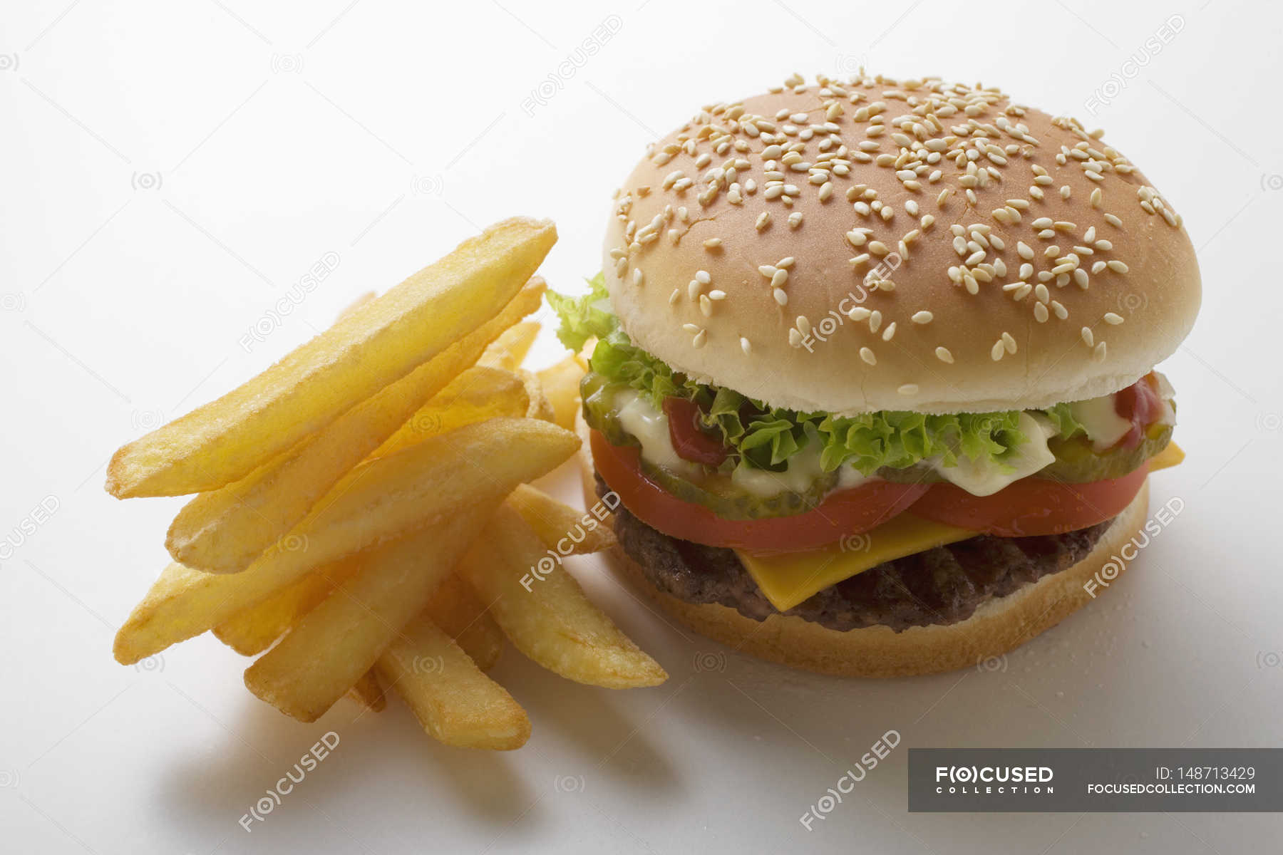 Cheeseburger with mayonnaise and chips — appetite, do it yourself ...