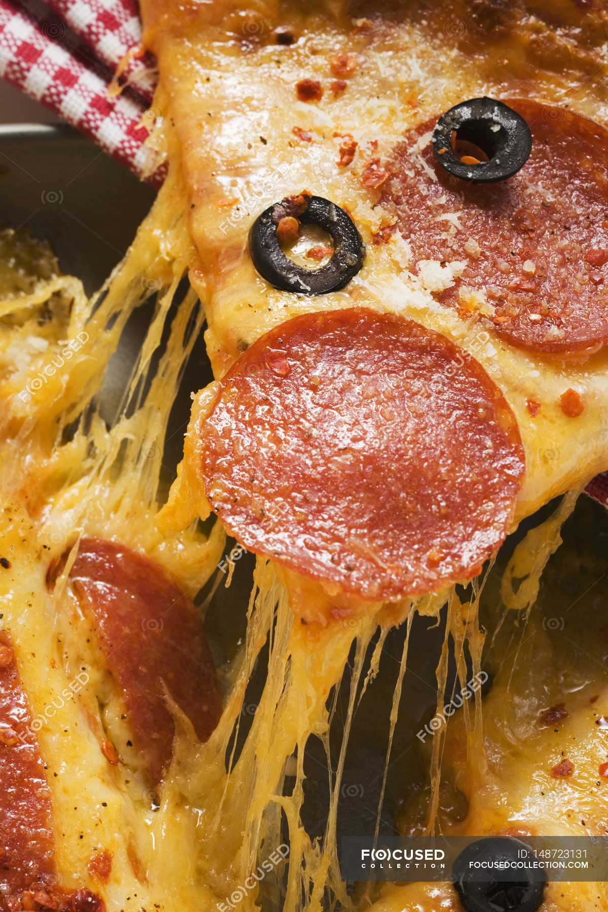 Pizza with salami, cheese and olives — main dish, salami pizza Stock