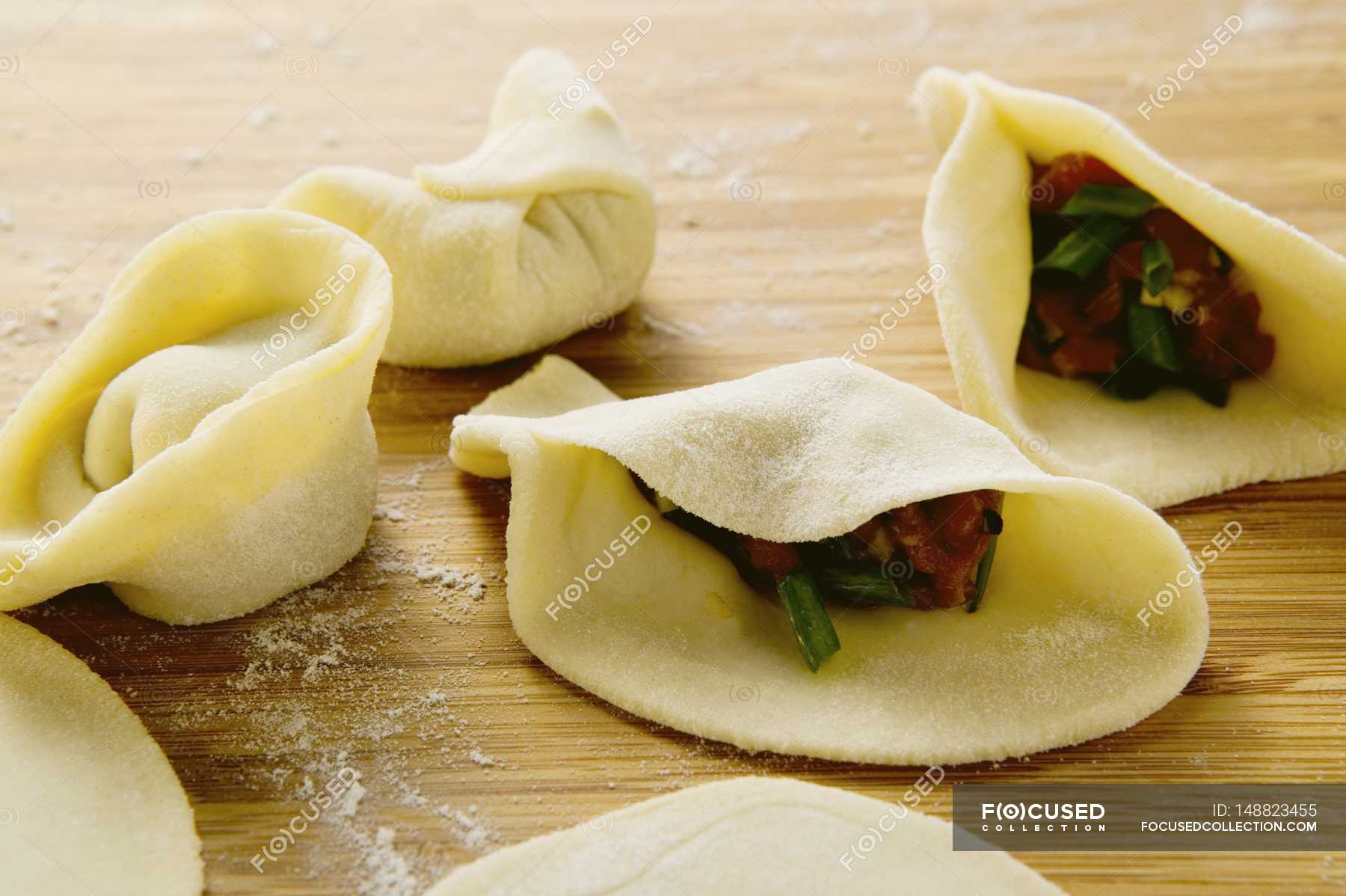 Filling pasta parcels with beef — healthy, kitchen - Stock Photo |  #148823455