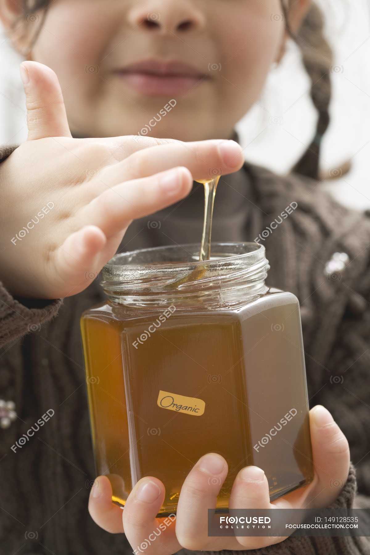 girl-tasting-honey-sugar-taste-stock-photo-149128535