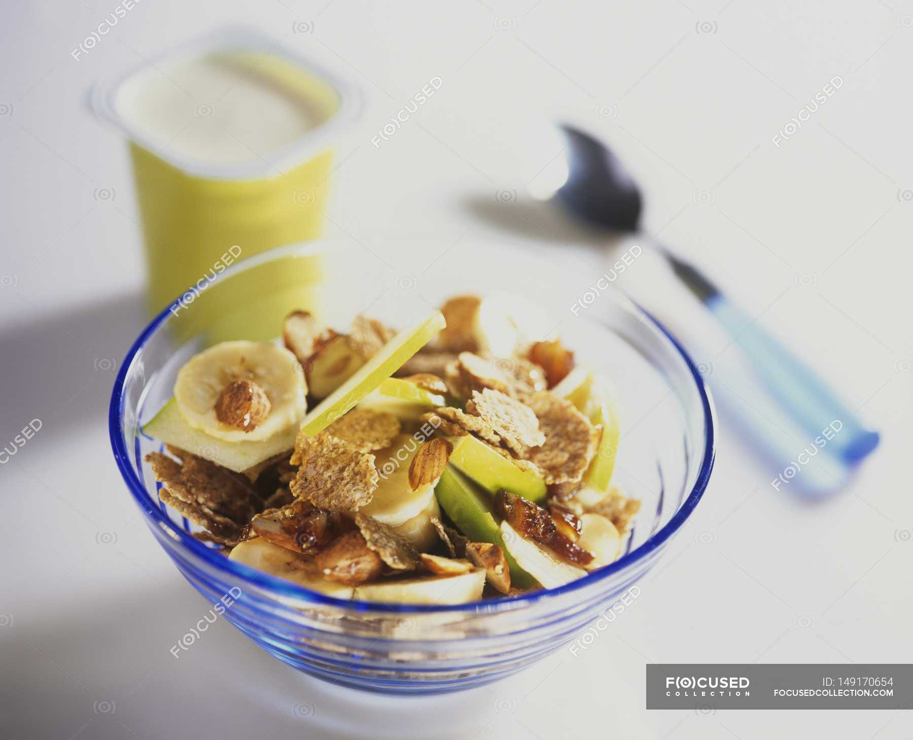 Muesli with apple and banana — almonds, bowl Stock Photo 149170654