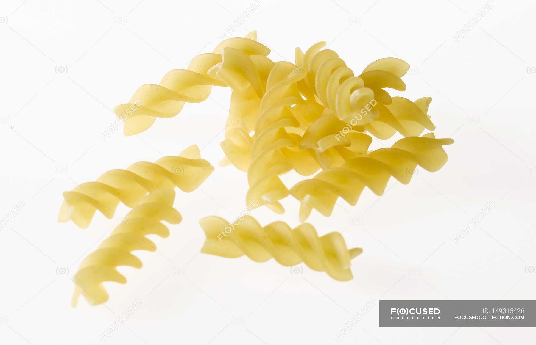 Raw fusilli pasta — objects, indoors - Stock Photo | #149315426