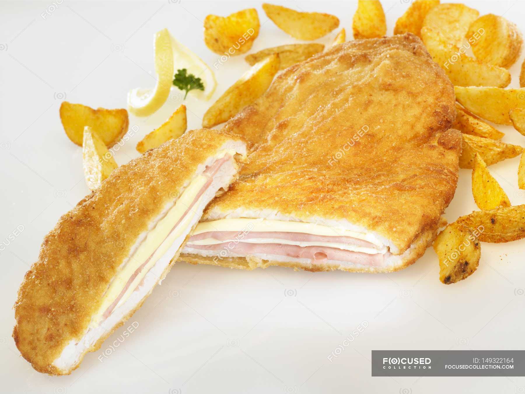 Chicken Cordon Bleu with potato wedges — agriculture, root vegetables