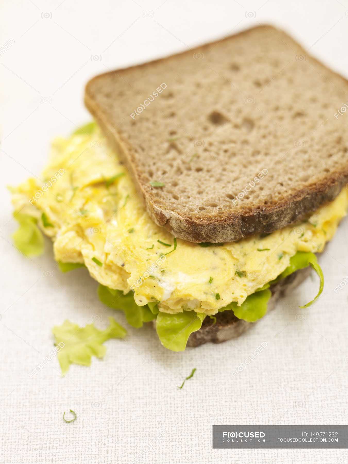 Scrambled Egg Sandwich Laying On White Surface Crust Snack Stock Photo