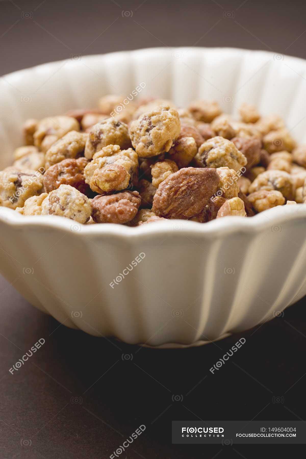 Mixed nuts to nibble — seeds, unfocused Stock Photo 149604004