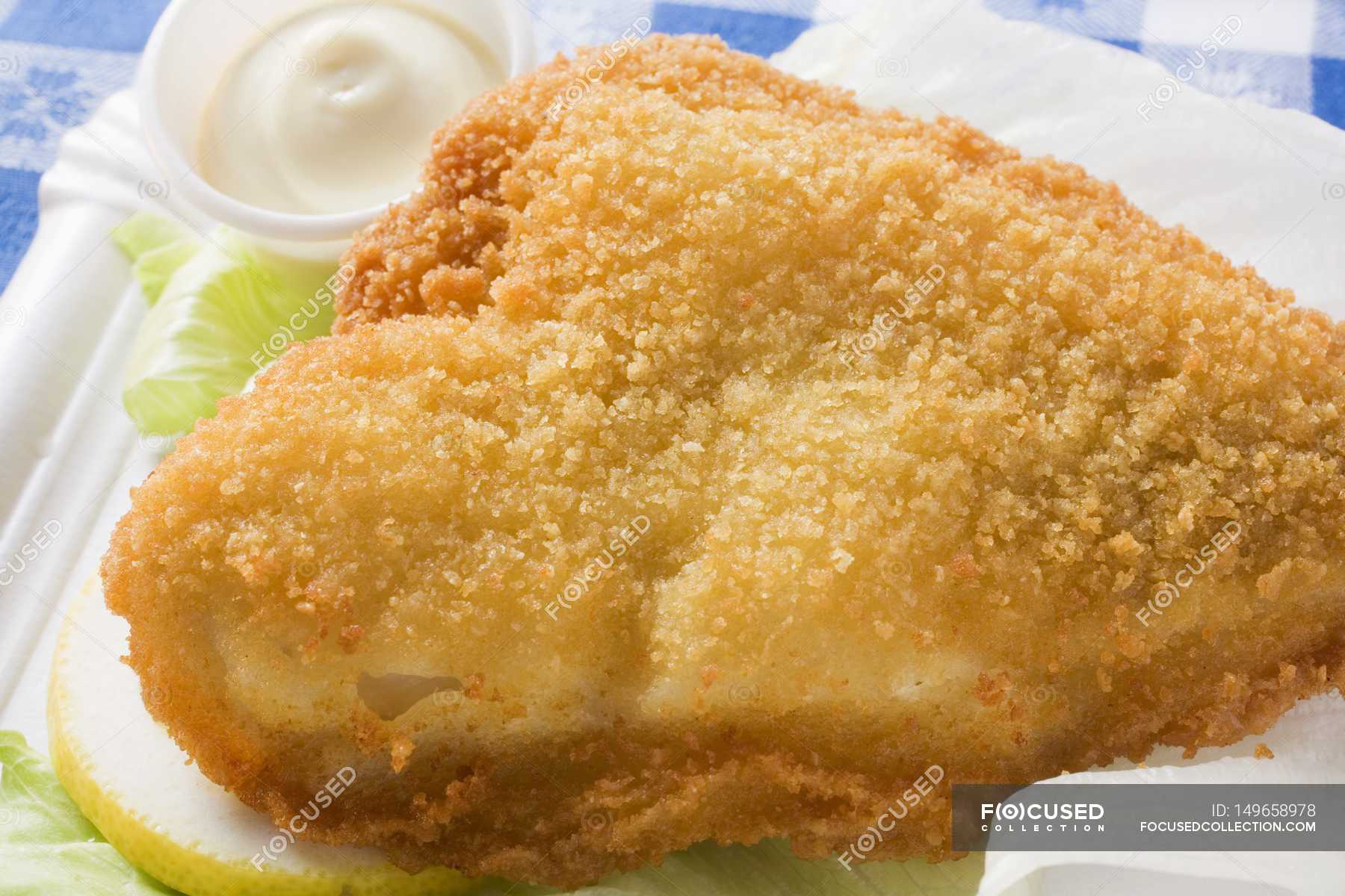 Breaded fish fillet with mayonnaise — food, seafood Stock Photo 149658978