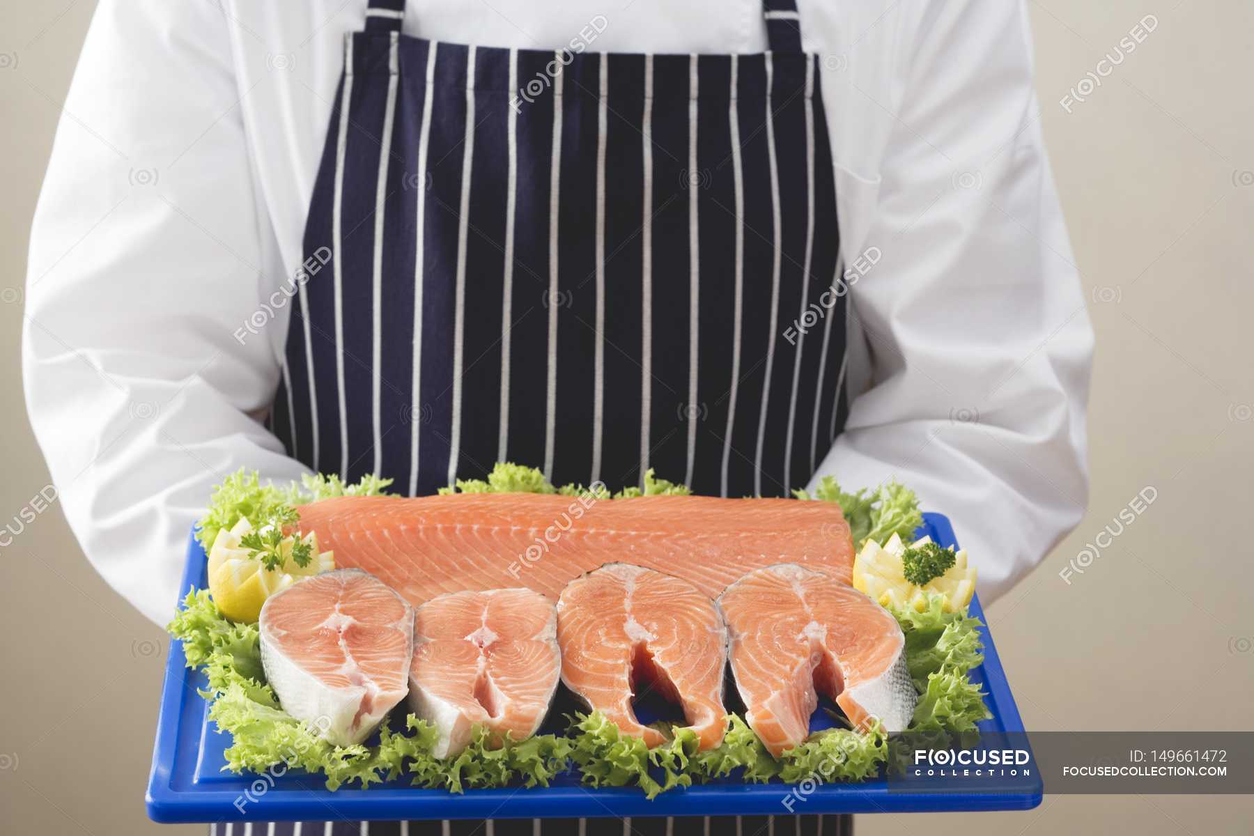 Various cuts of salmon on chopping board — details, gastronomy - Stock ...