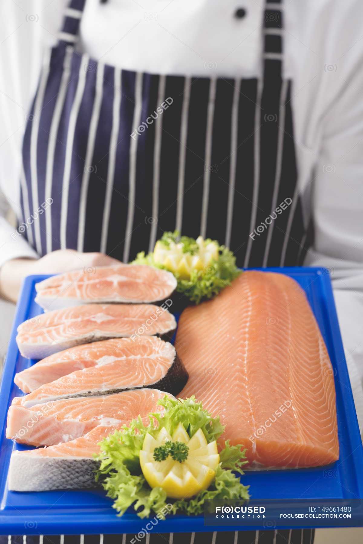 Various cuts of salmon on chopping board — tasty, gastronomy - Stock ...