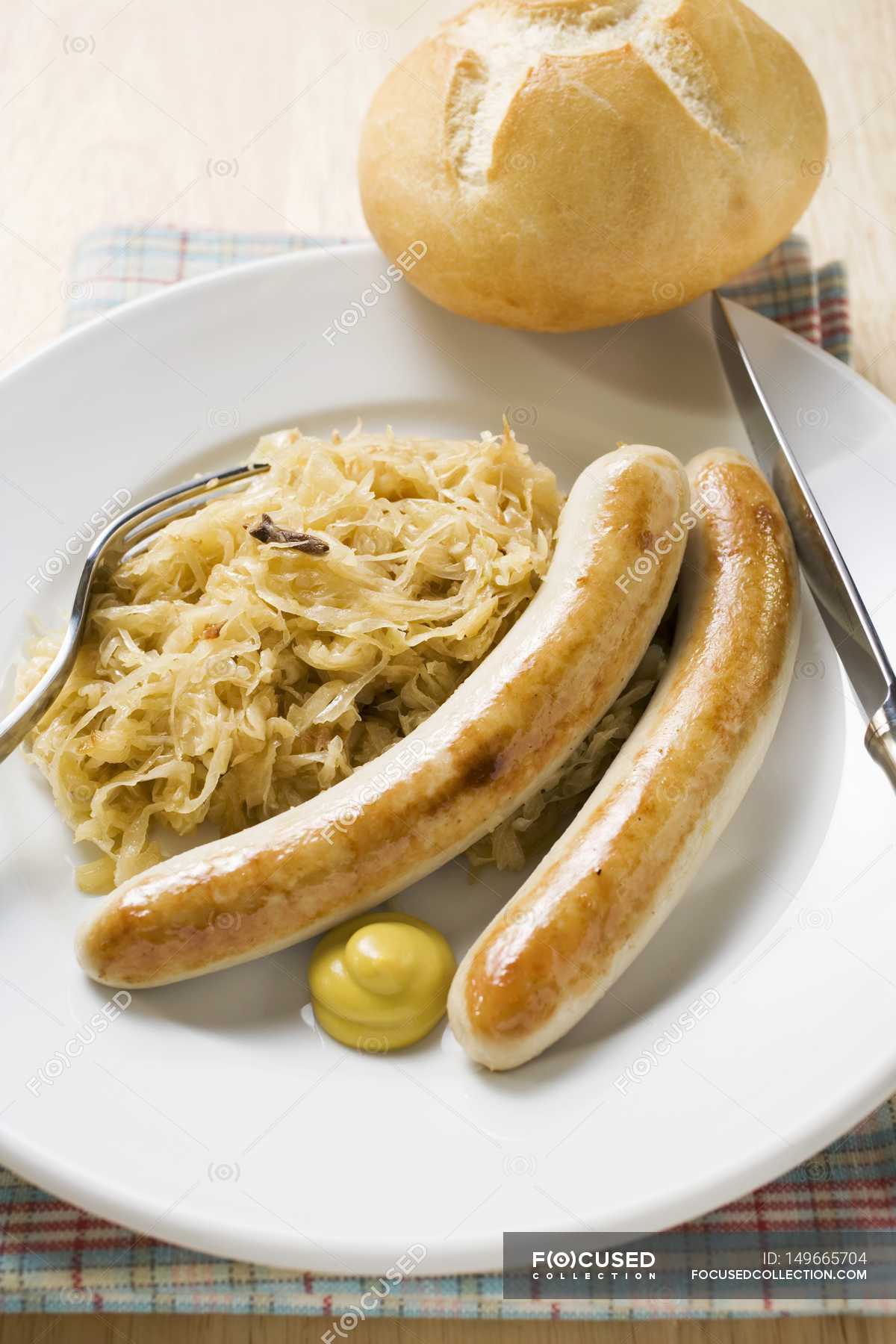 Sausages with sauerkraut and mustard — kitchenware, delicious Stock
