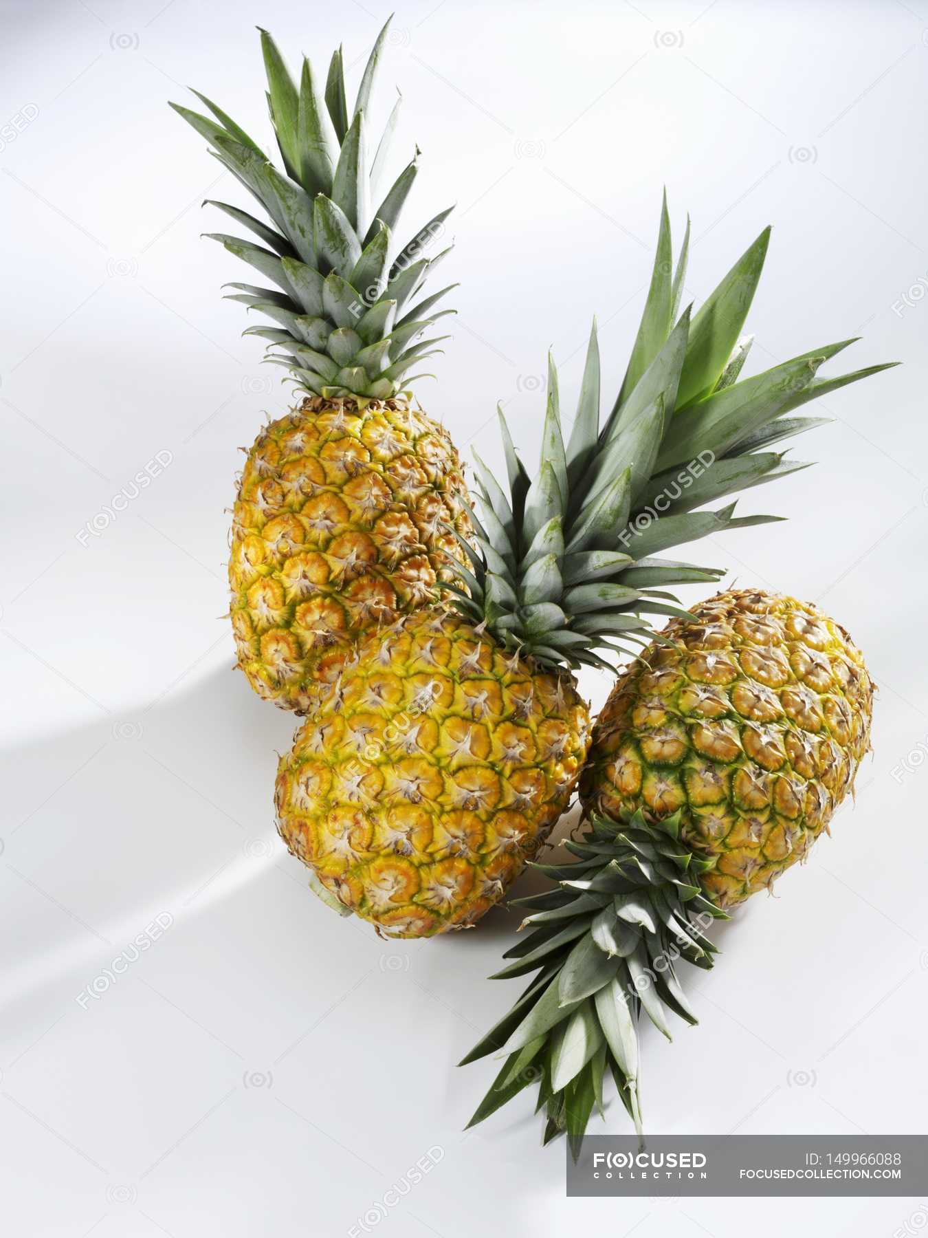 Three ripe pineapples — appetite, meal Stock Photo 149966088