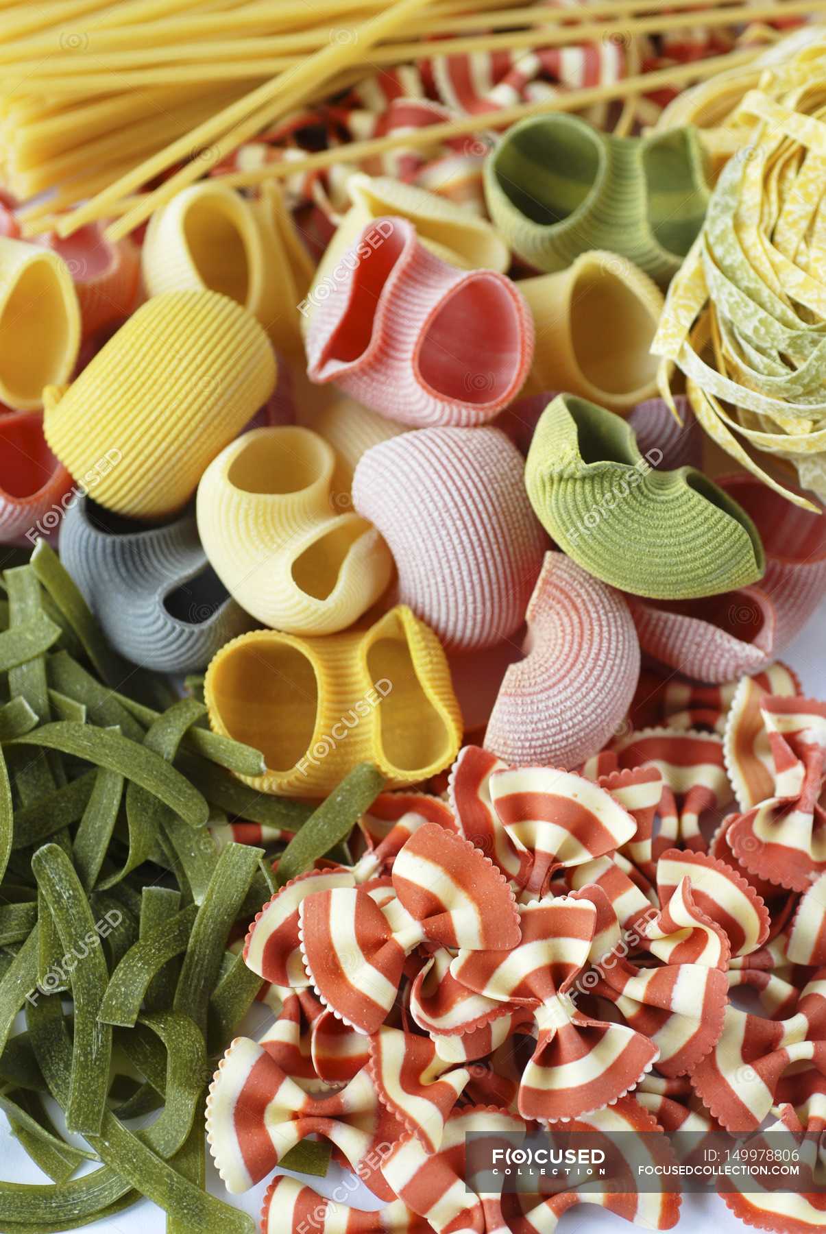 Various types of coloured pasta — healthy, edible - Stock Photo | #149978806