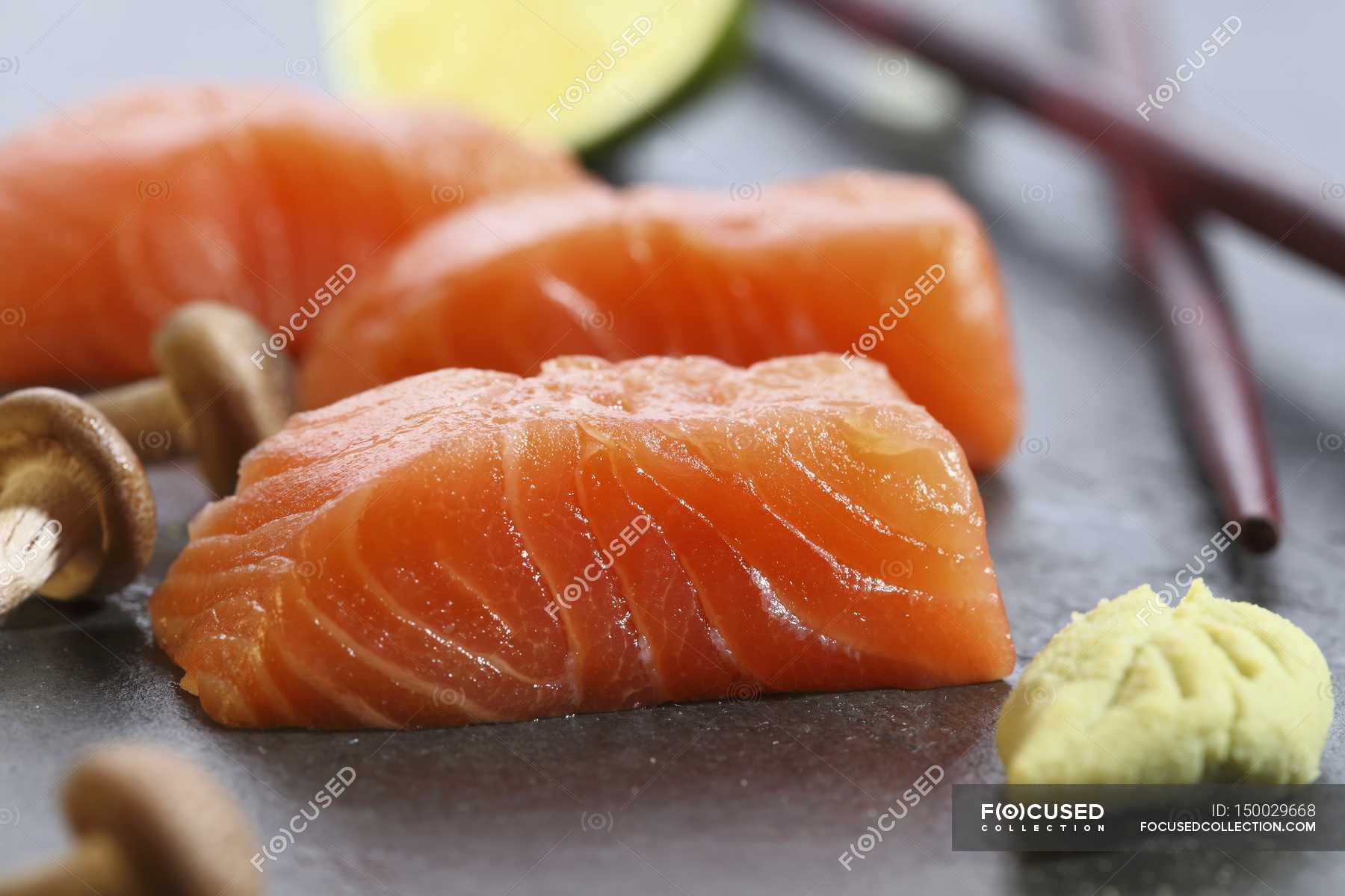 Salmon sashimi, wasabi and mushrooms — cooking, oriental food - Stock ...