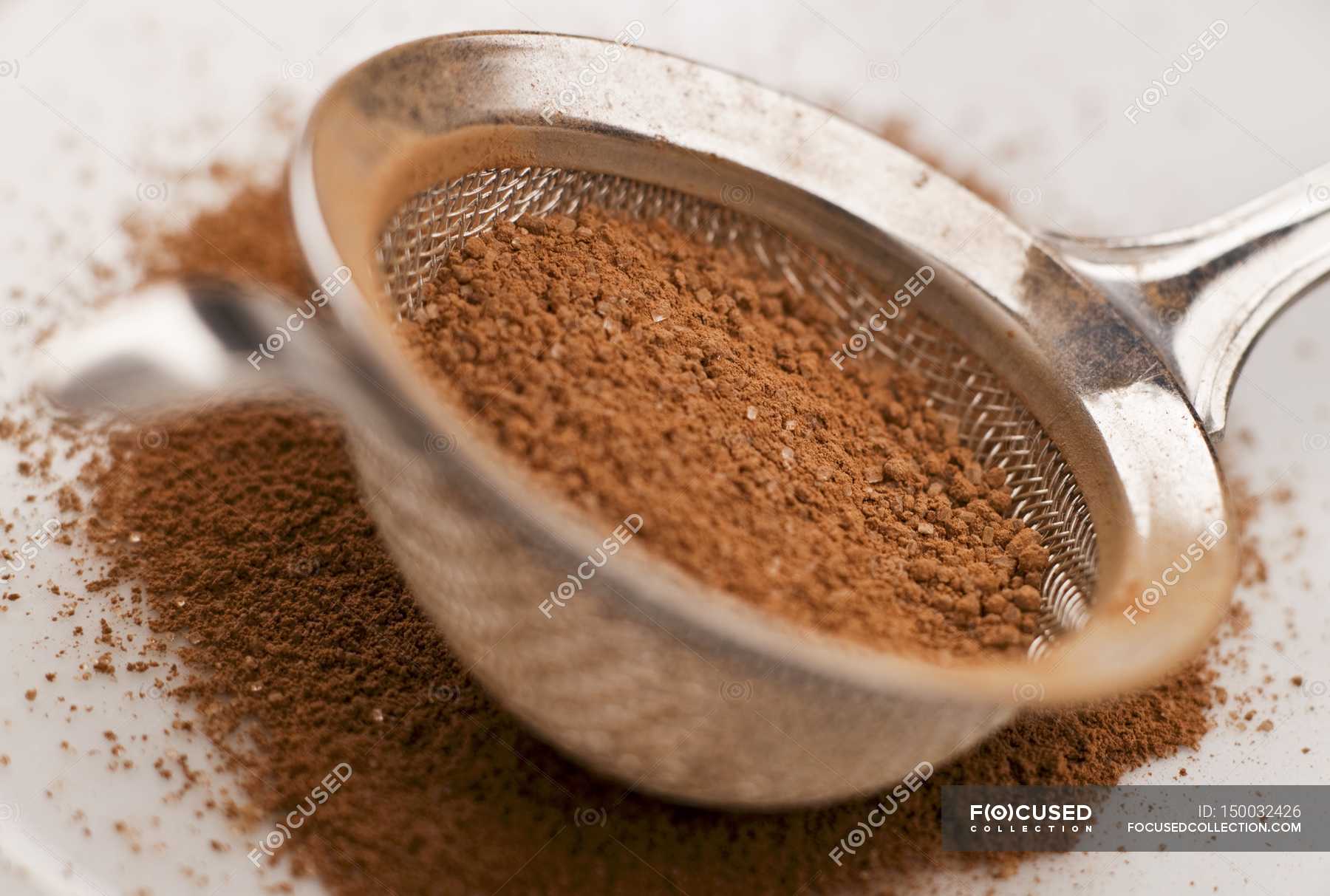 cocoa-powder-mixed-with-sugar-out-of-focus-strainer-stock-photo