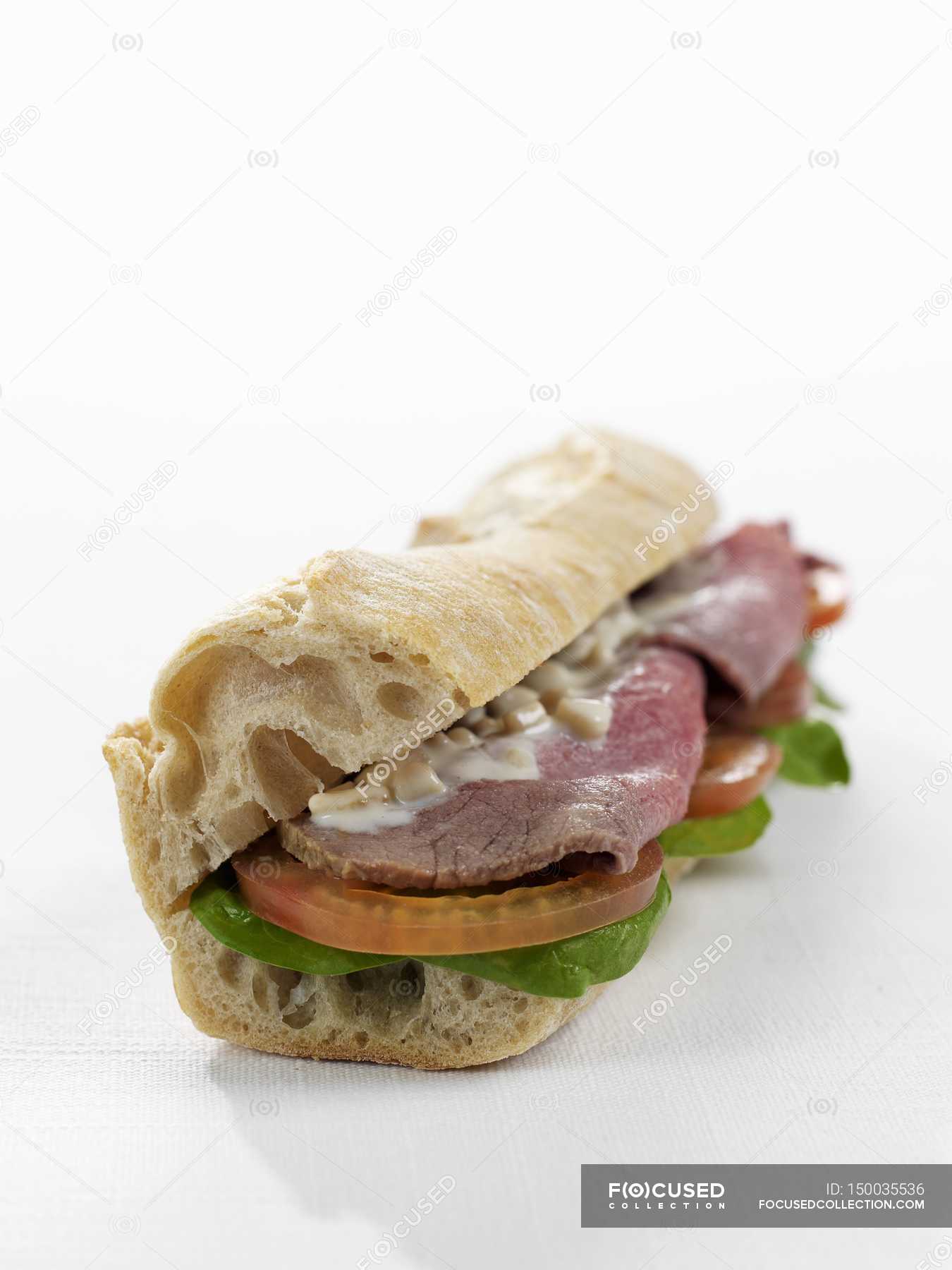 Baguette sandwich with roast beef — filled, filling Stock Photo 150035536