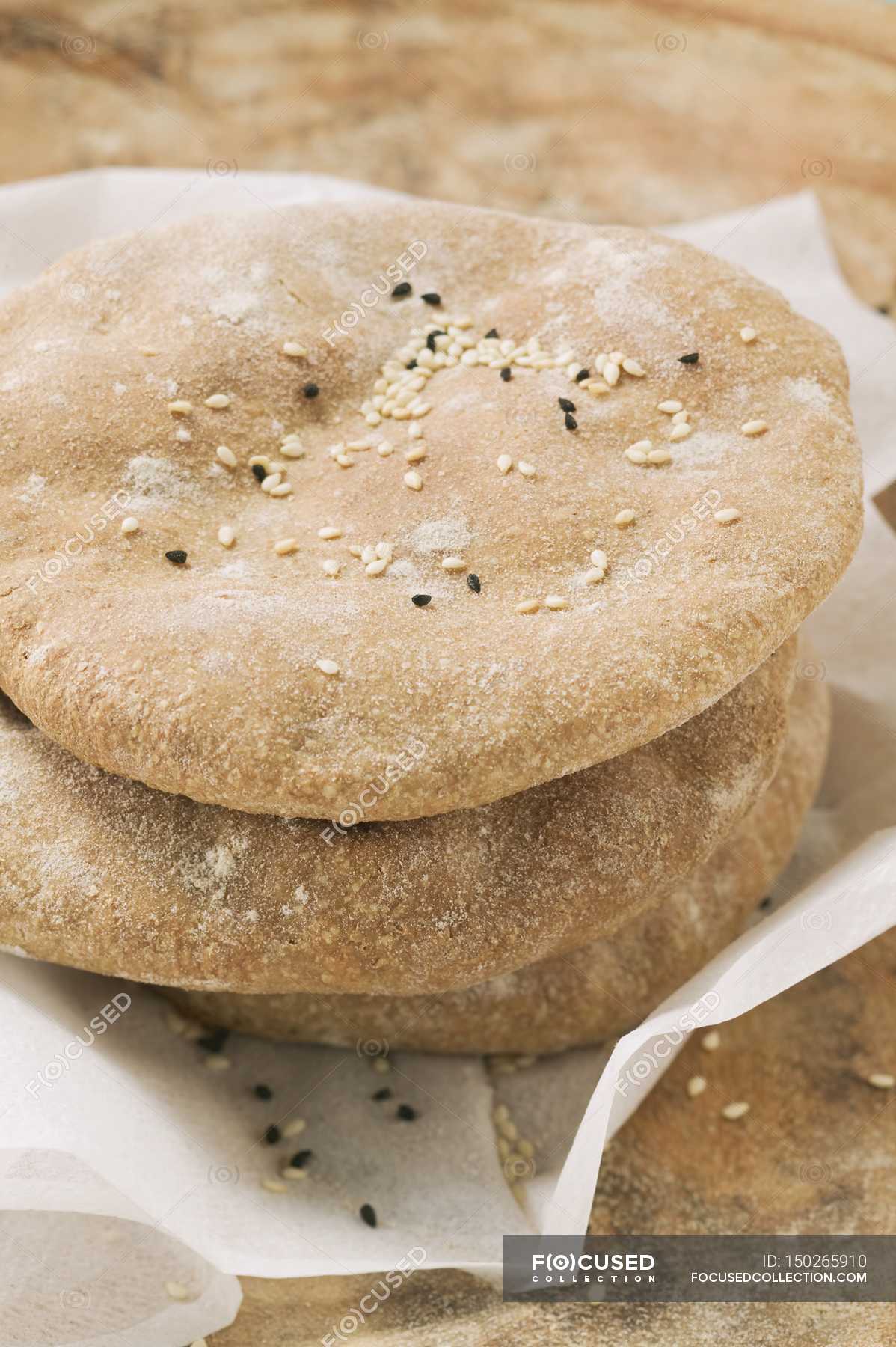 Flatbread with seeds — product, loaf Stock Photo 150265910