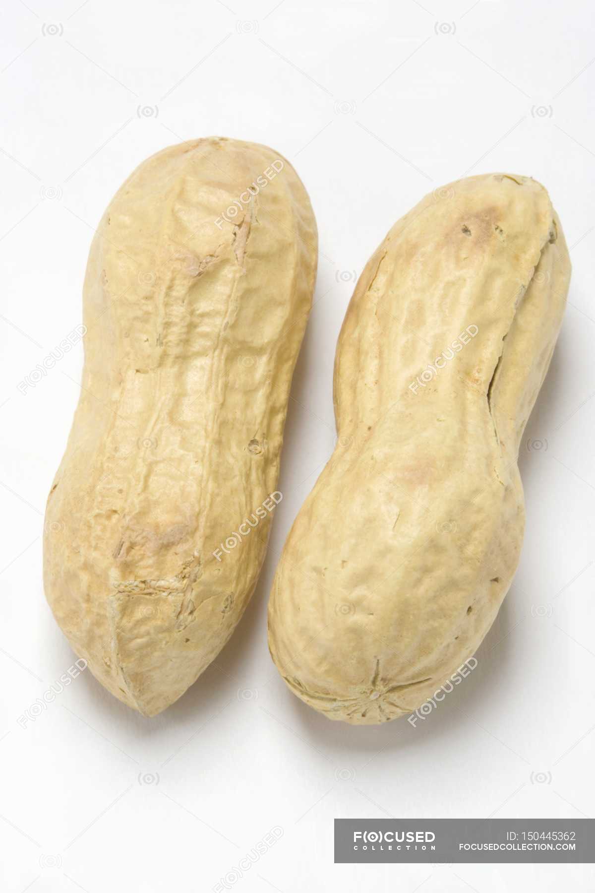 Two unshelled peanuts — surface, yummy Stock Photo 150445362