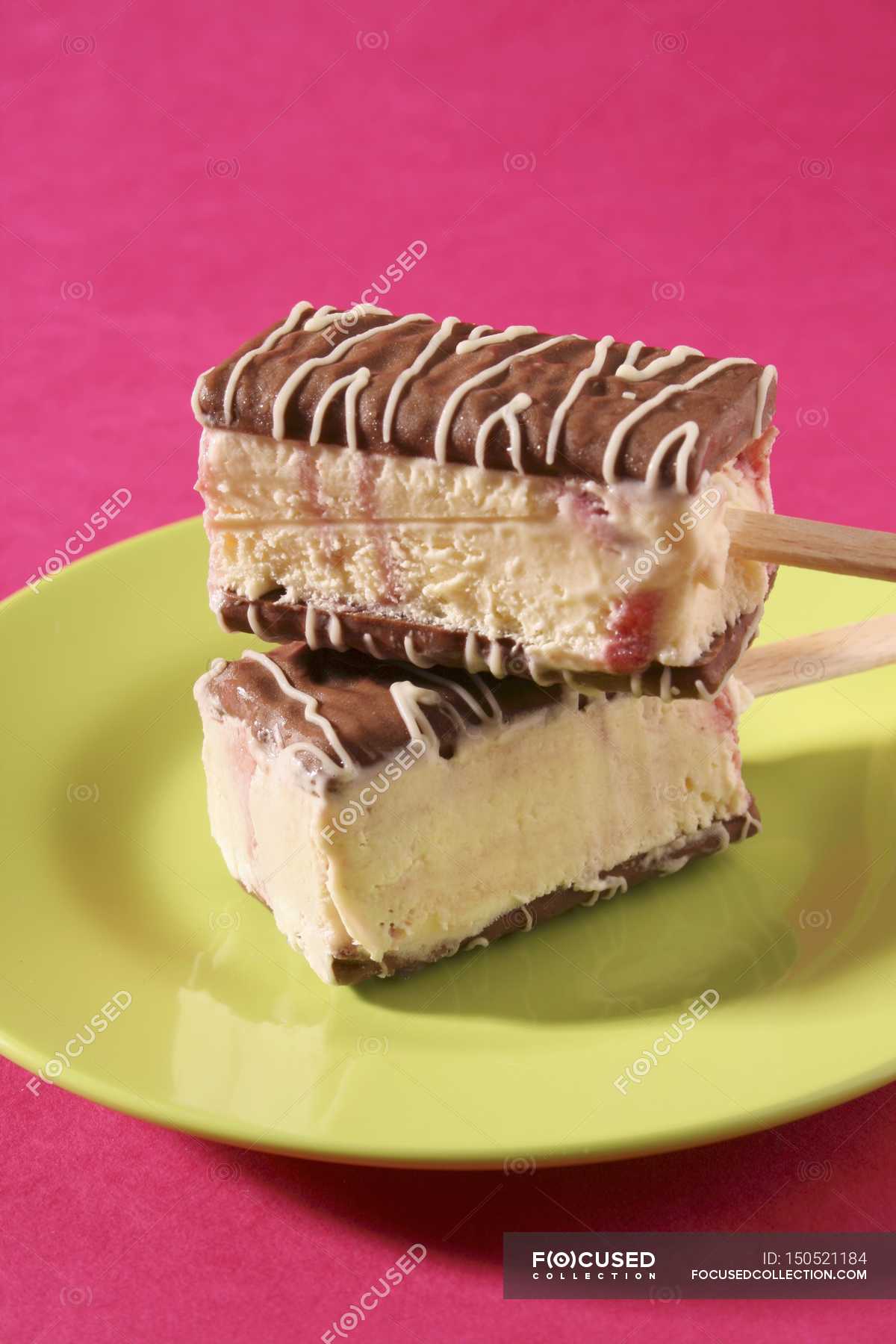 Closeup View Of Two Chocolate Amarena Ice Cream Slices On Sticks