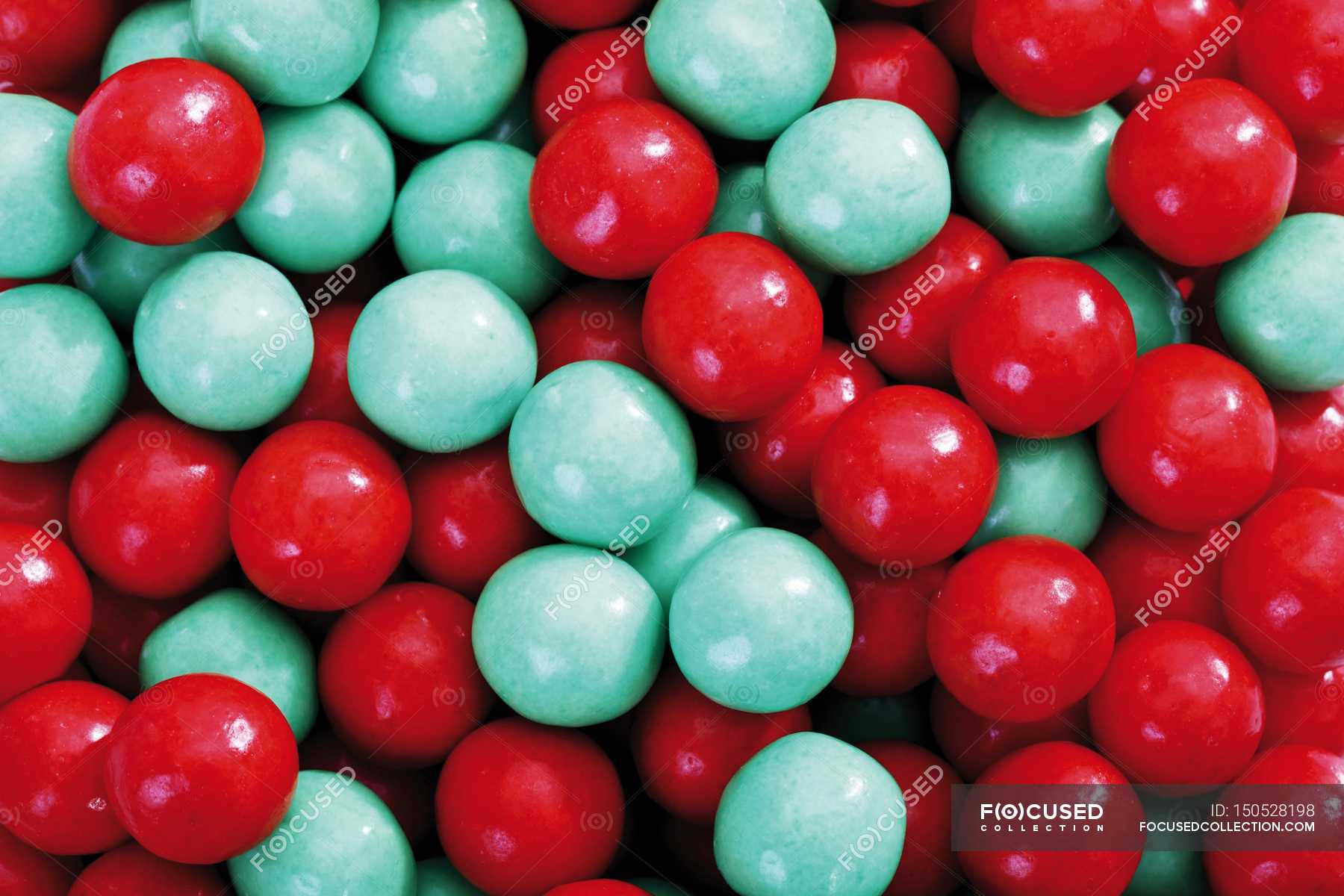 Red and blue gumballs — uncooked, overhead - Stock Photo | #150528198