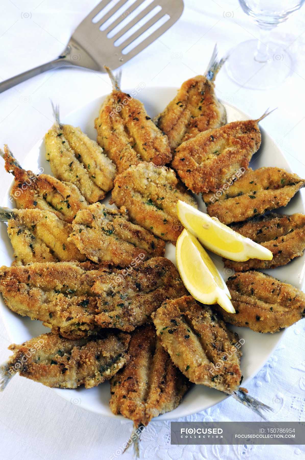 Fried sardines with herb — cuisine, hunger Stock Photo 150786954