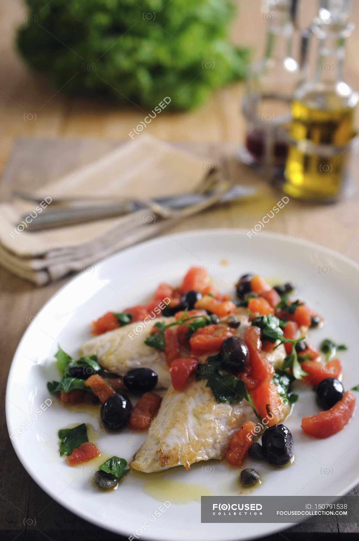 Pan fried fillets of John Dory — Elevated View, olives Stock Photo