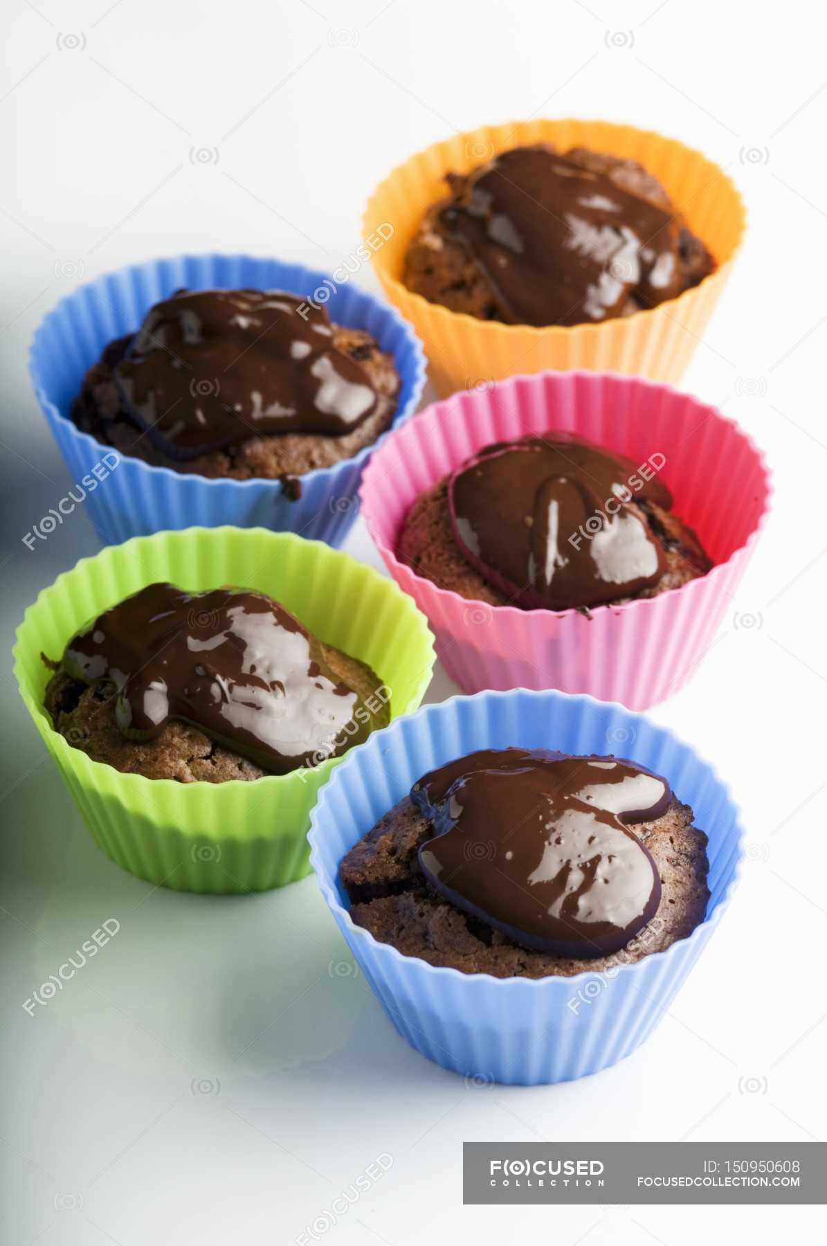 Muffins in colored cases — baked products, biscuits Stock Photo