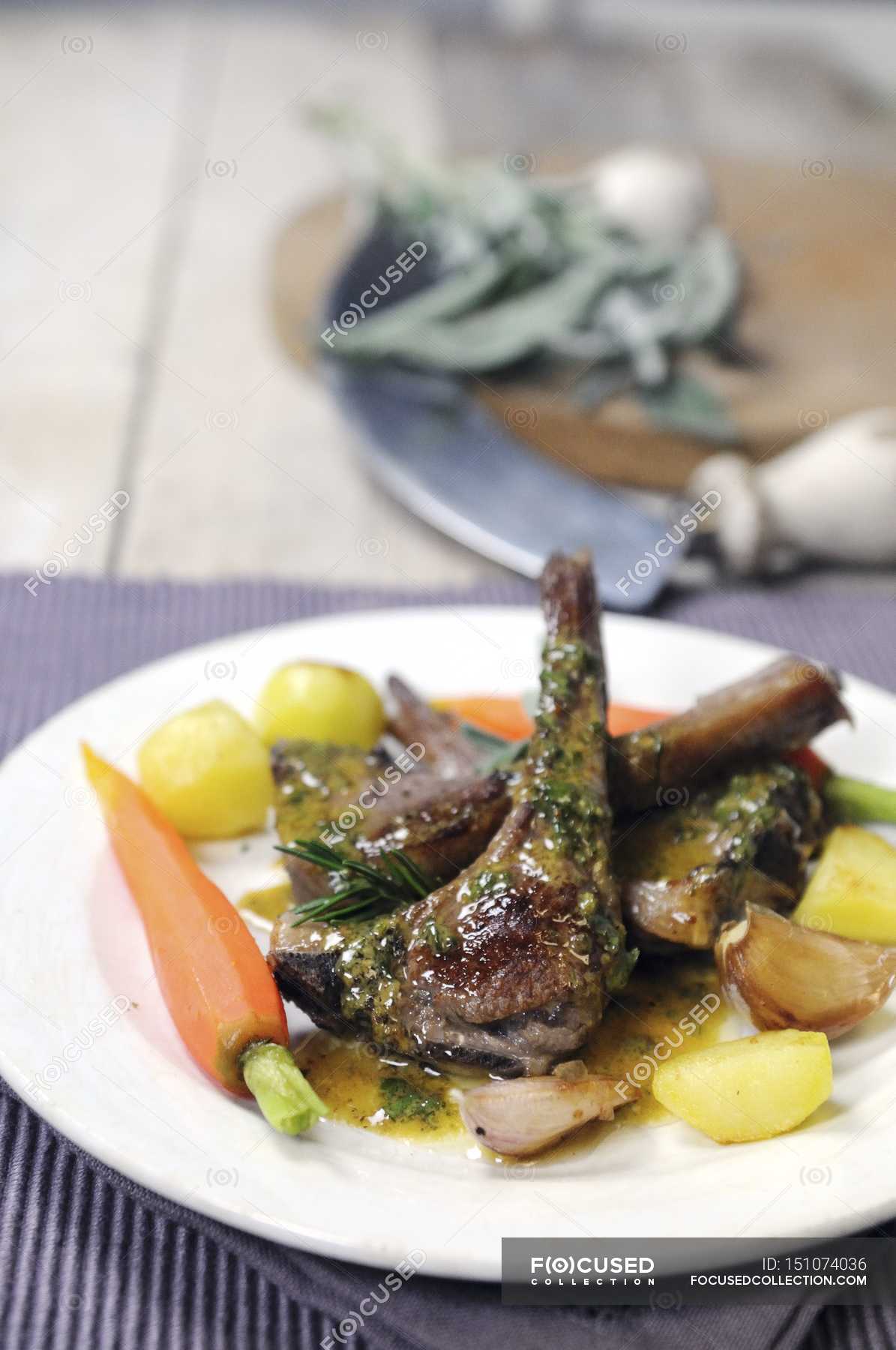 Lamb chops with potatoes — carrots, product - Stock Photo | #151074036