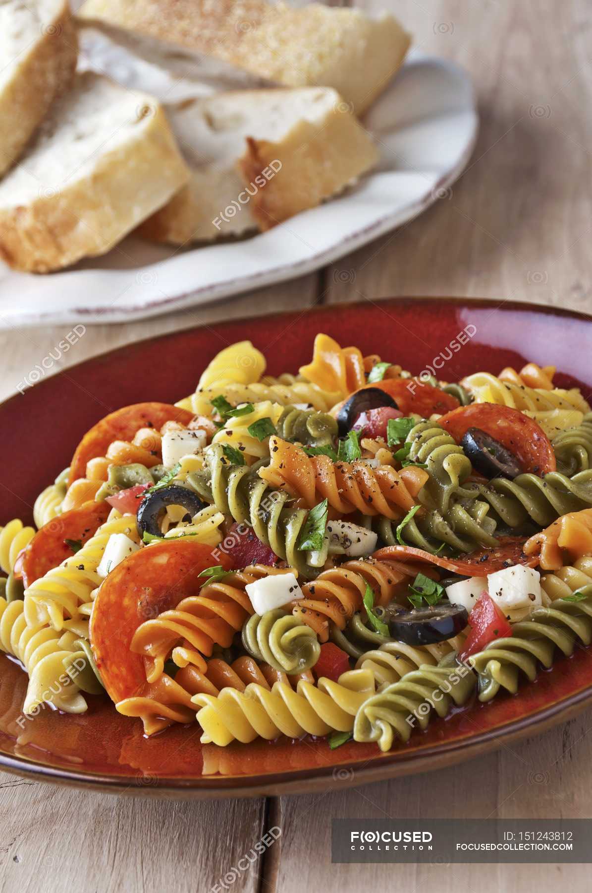 Tricolored rotini pasta salad — indoors, yummy Stock Photo 151243812